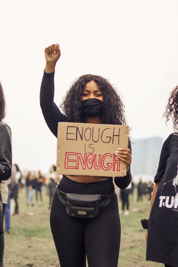 portrait protester holding a sign
